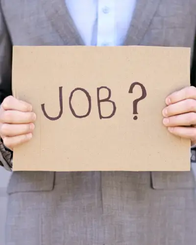 Holding a paper wrote "JOB?"