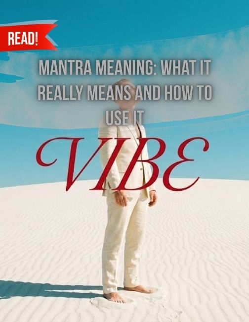 A man in white standing in a desert.