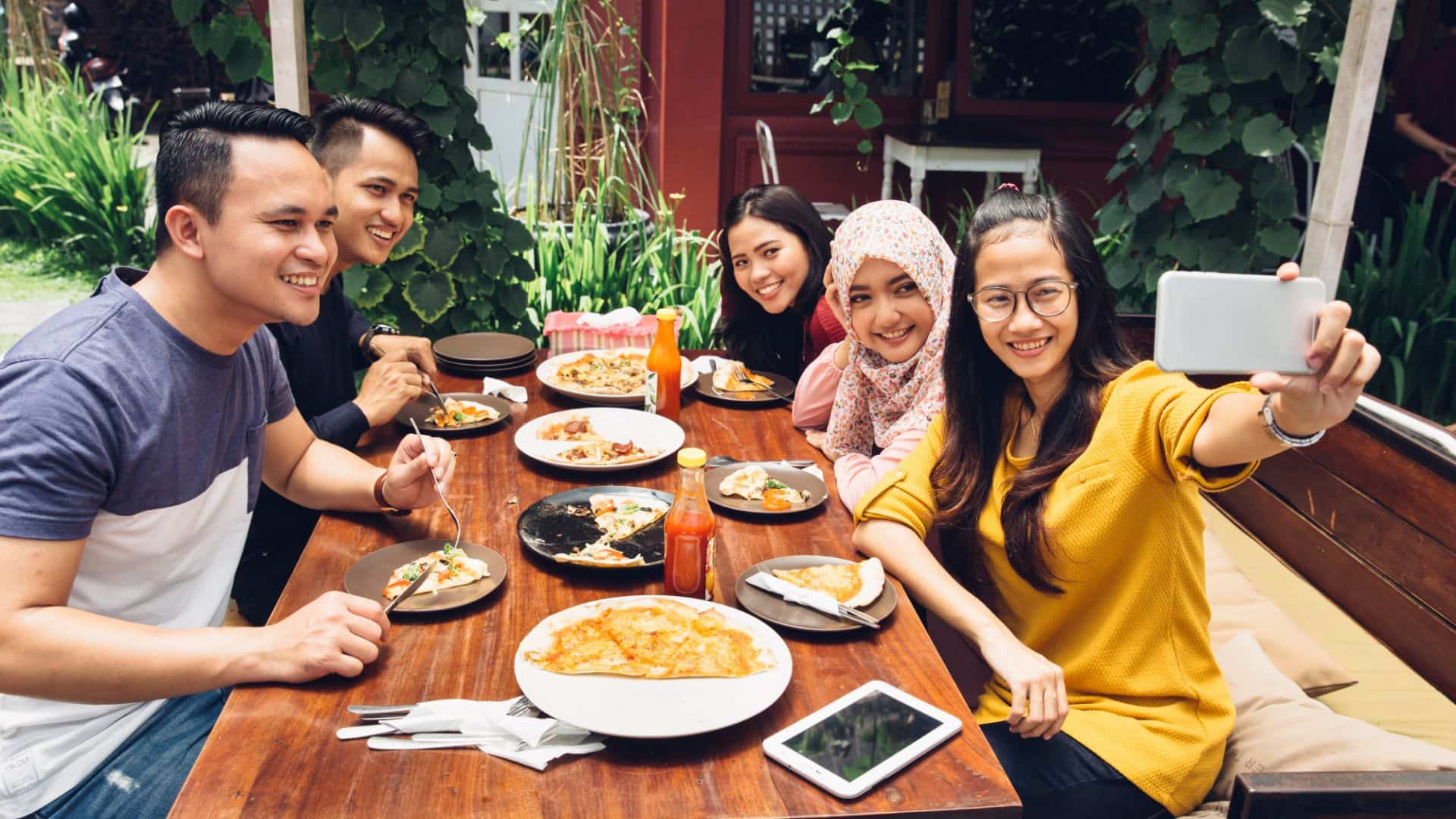 Friends and family gathering at restaurant, Malaysia food culture