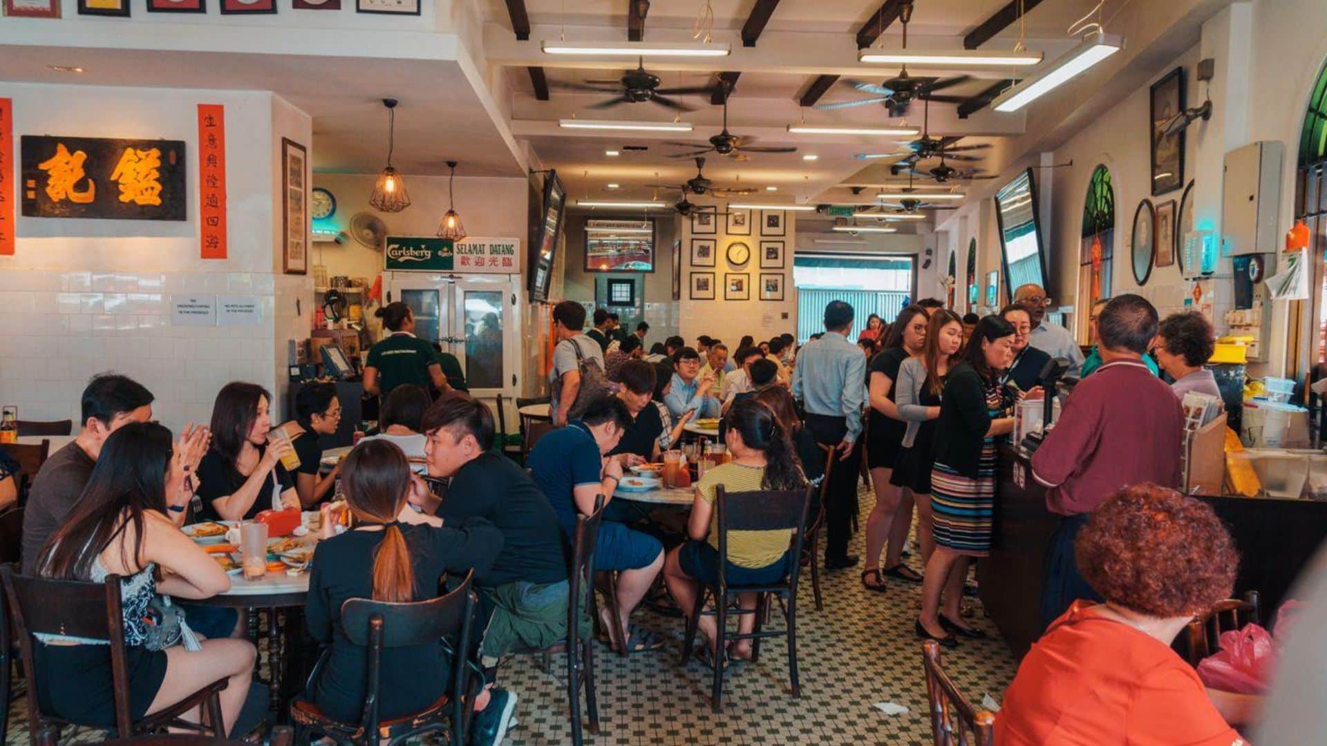 Packed Chinese kopitiam at breakfast and lunch time selling Malaysian foods.